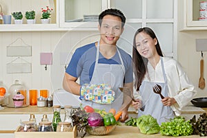 Happy couple cooking together,Man and woman in the kitchen