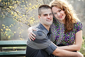 Happy couple - cute lovers in park