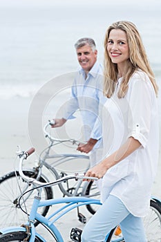 Happy couple cycling together