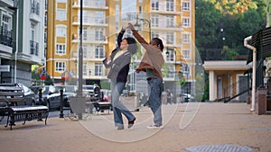 Happy couple dancing street residential area together. Gentle romantic relations