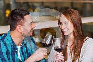 Happy couple dining and drink wine at restaurant