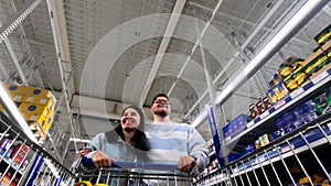 happy couple do groceries shopping