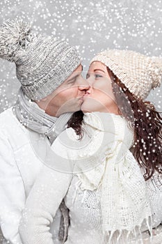 Happy couple dressed in warm clothes in winter