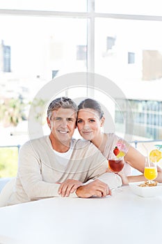 Happy couple drinking a glass