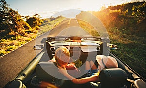 Happy Couple Driving in Convertible