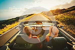 Happy Couple Driving in Convertible