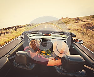 Happy Couple Driving in Convertible