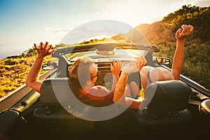 Happy Couple Driving in Convertible