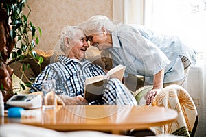 Happy couple embracing and head pressed against each other