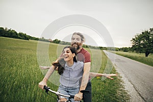 Happy couple enjoy cycling together in nature