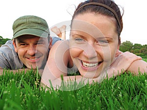 Happy couple enjoy summer day in the park.