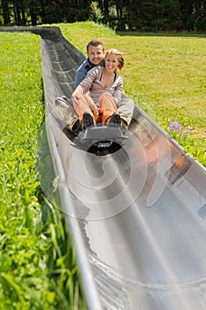 Happy Couple Enjoying Alpine Coaster Luge