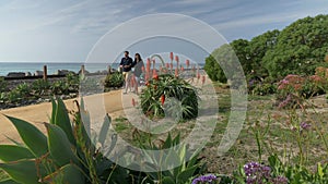 Happy couple enjoying beautiful day walking holding hands on the beach. Travel vacation retirement lifestyle concept