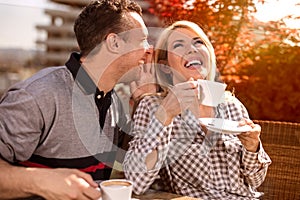 Happy couple enjoying a coffee at the coffee shop