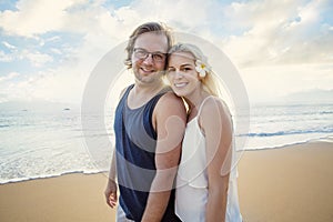 Happy couple enjoying an exotic island honeymoon together