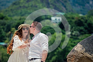 Happy couple enjoys life on a tropical island