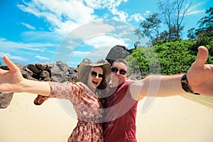 Happy couple enjoys life on a tropical paradise island