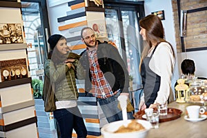 Happy couple entering cafeteria