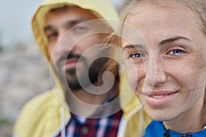 Happy couple faces posing outdoor while hiking