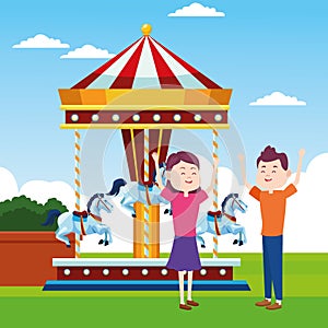 Happy couple and fair horses carousel over landscape background