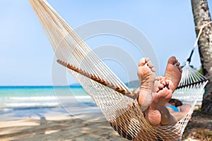 Happy couple family in hammock on tropical paradise beach, island holidays