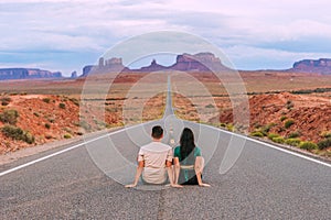 Happy couple on the famous road to Monument Valley in Utah. Amazing view of the Monument valley.