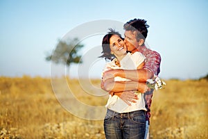 Happy couple in a field