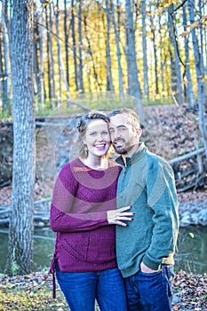 Happy Couple in a Forest in the Fall
