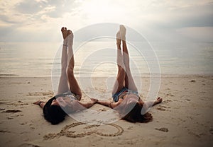 Lovers young couple of girls. On the beach . Concept of LGBT