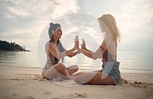 Lovers young couple of girls. On the beach . Concept of LGBT