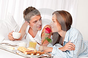 Happy couple having breakfast