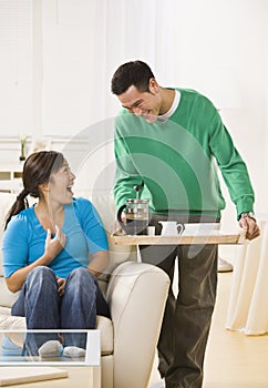 Happy Couple Having Coffee at Home