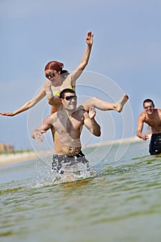 Happy couple having fun on the beach