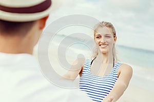 Happy couple having fun on the beach