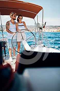 Happy couple having fun on a boat trip