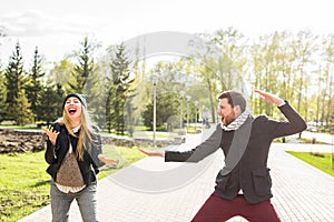 Happy couple having fun and fooling around. Joyful man with woman have nice time. Good relationship.