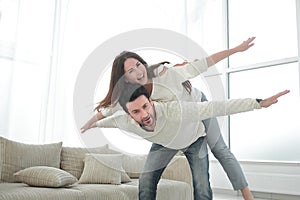 Happy couple having fun in a new apartment