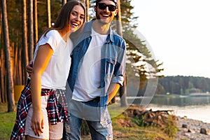 Happy couple having fun outdoors and smiling.