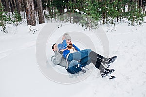 Happy Couple Having Fun Outdoors in Snow Park. Winter vacation