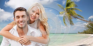 Happy couple having fun over beach background