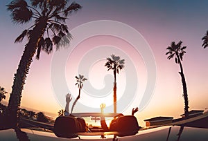 Happy couple having fun during road trip in convertible car - Young lovers enjoying vacation in tropical city