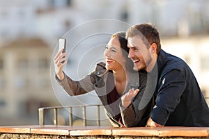 Happy couple having a video call or taking selfies