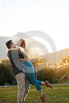 Happy couple, hug and laughing in park for marriage anniversary or funny joke, love or romance. Man, woman and pick up