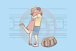 Happy couple hug meeting at railway station