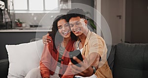 Happy couple, hug and peace sign with selfie on sofa for bonding, photography or moment together at home. Young man and