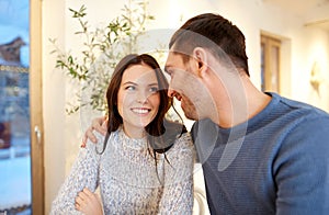 Happy couple hugging at cafe or restaurant