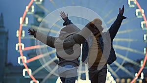 Happy couple hugging in city center. Man and woman having fun outdoor.