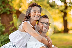 happy couple hugging at summer park