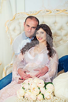 Happy Couple: husband and pregnant wife waiting for baby