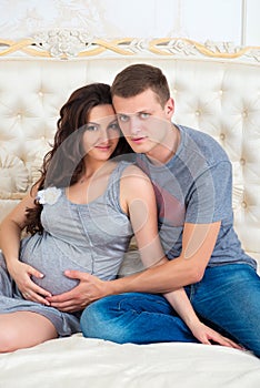 Happy Couple: husband and pregnant wife waiting for baby